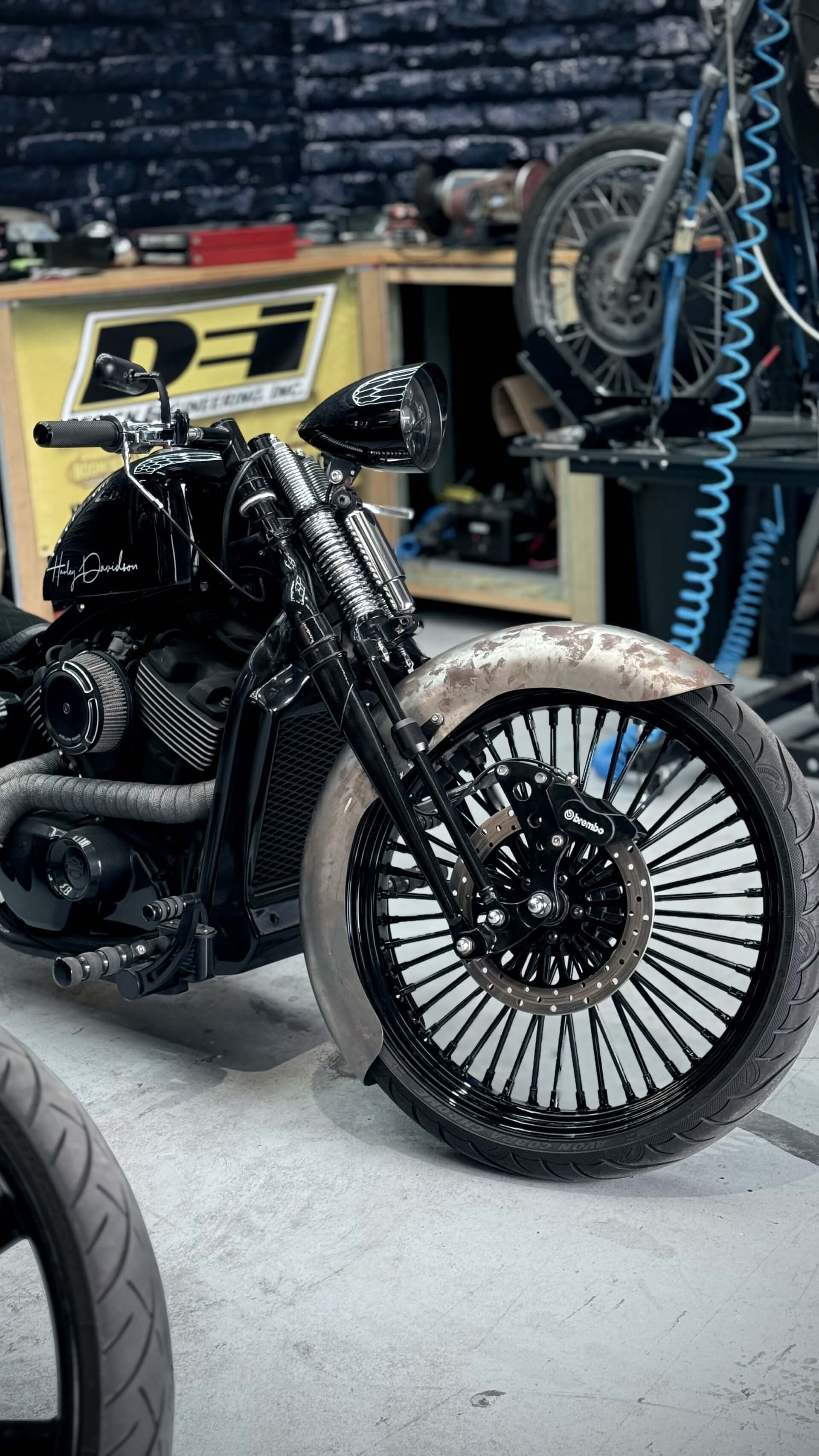 Street 500 Harley front-end with custom short guard and welded brackets – built by Knuckle Heads Customs.